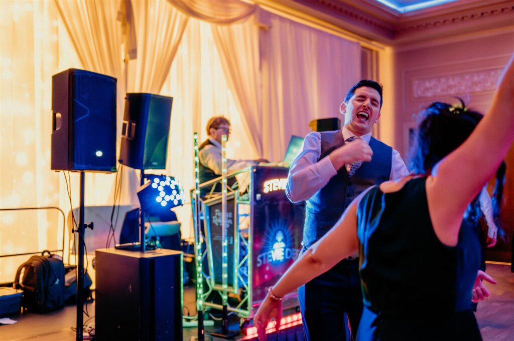 People having fun on the dance floor of a wedding