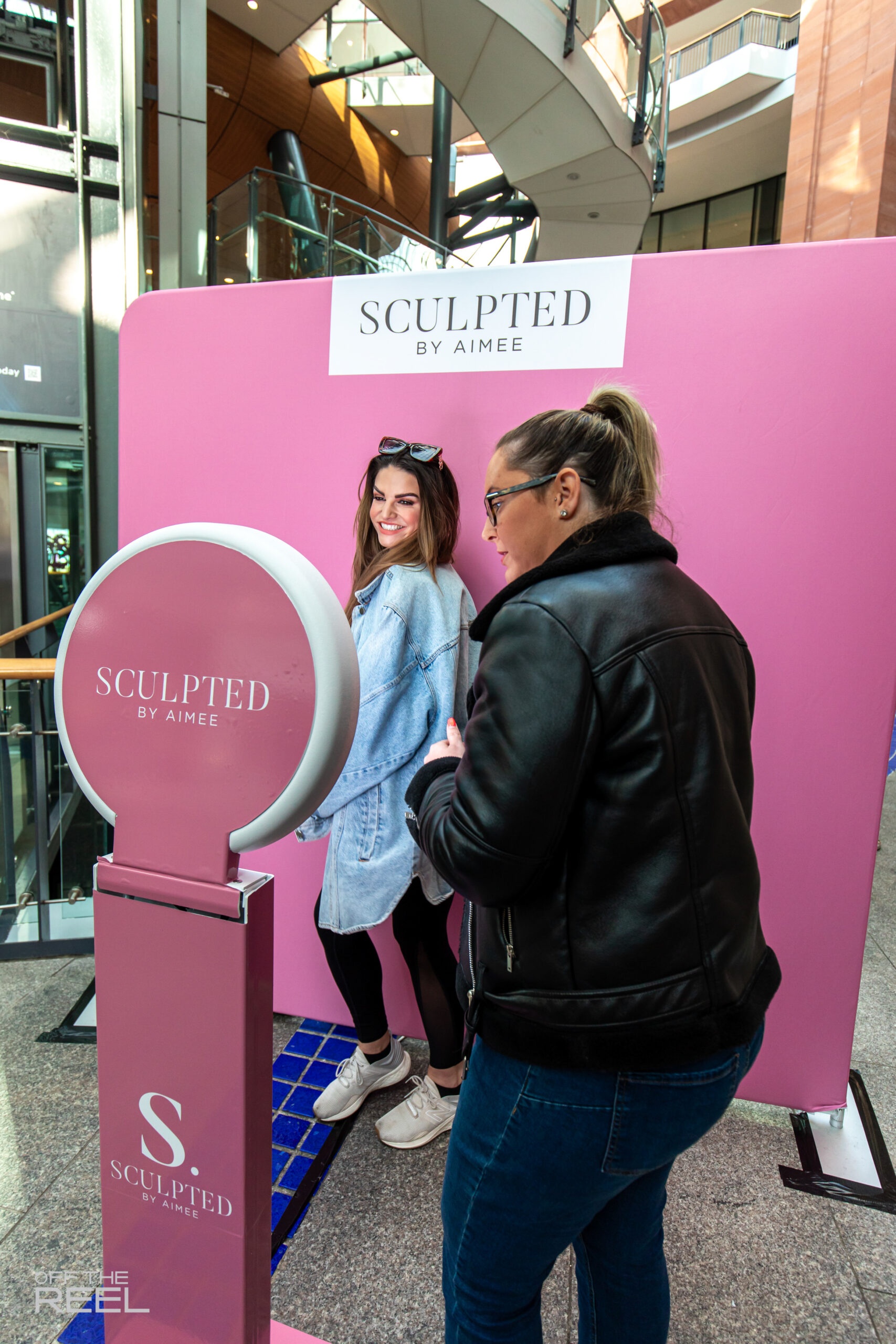Branded pink photo booth backdrop at a shopping centre brand activation