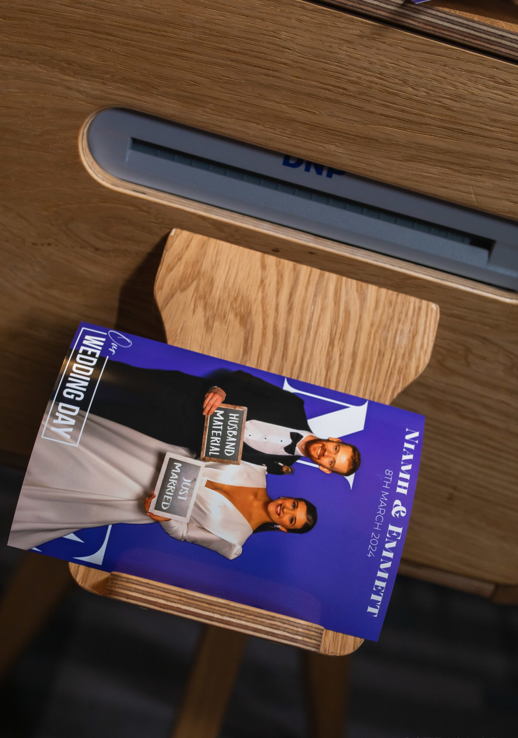 Close-up of a photo booth printer producing personalised wedding prints